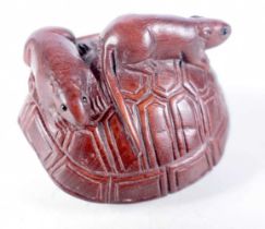 A Carved Hardwood Netsuke of Two Mice climbing on the back of a Giant Tortoise Shell. 4.3 cm x 3.3