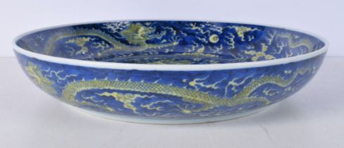 A Chinese porcelain Dish decorated with a Dragon and clouds 6.5 x 33 cm