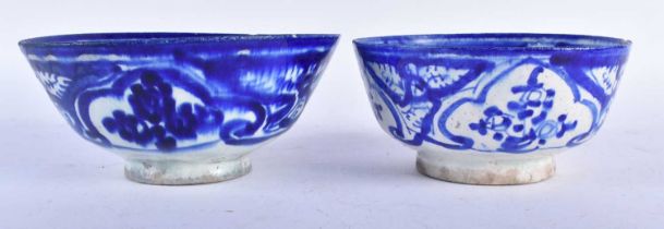 TWO ANTIQUE PERSIAN SAFAVID BLUE AND WHITE POTTERY BOWLS. Largest 18cm wide. (2)
