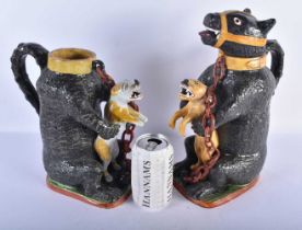 A PAIR OF LATE 18TH/19TH CENTURY PRATTWARE BEAR BAITING JUGS each modelled holding a scowling beast,