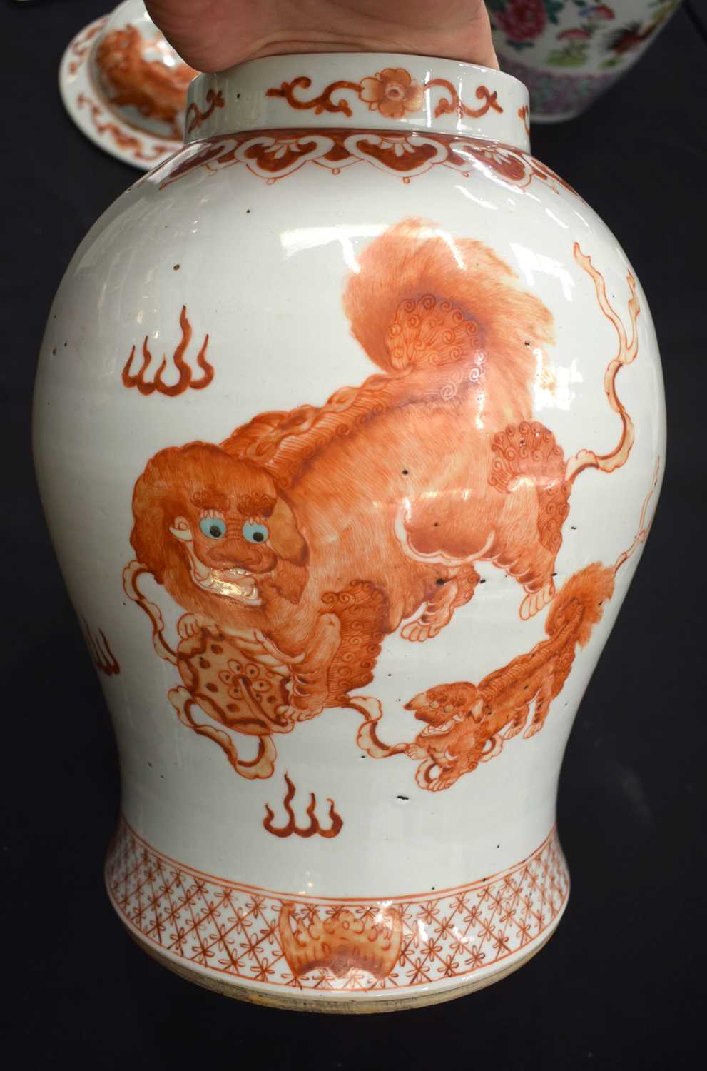 A LARGE PAIR OF CHINESE QING DYNASTY IRON RED PAINTED GINGER JARS AND COVERS painted with buddhistic - Image 12 of 26