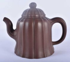 A CHINESE YIXING POTTERY TEAPOT AND COVER 20th Century. 14 cm x 12 cm.