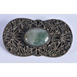 A Filigree Brooch set with a Jade Cabochon. 4.8 cm x 2.6 cm, weight 11.65g