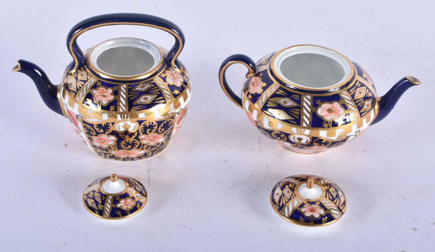 TWO MINIATURE ROYAL CROWN DERBY IMARI TEAPOTS AND COVERS. Largest 7 cm x 8 cm. (2) - Image 2 of 3