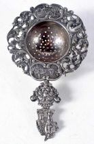 A Dutch Silver Tea Strainer with ornate decoration. 12.5 cm x 7.5 cm, weight 41g