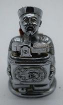 A NOVELTY CHROME SEATED CHINAMAN DRAGON LIGHTER. 209 grams. 9 cm x 5.5 cm.