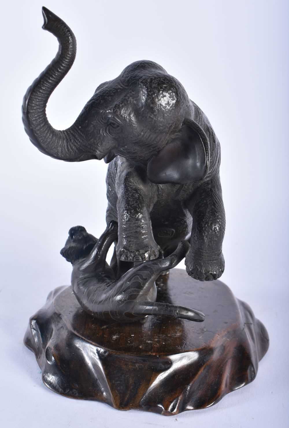 A 19TH CENTURY JAPANESE MEIJI PERIOD BRONZE OKIMONO modelled as an elephant being attacked by - Image 4 of 8