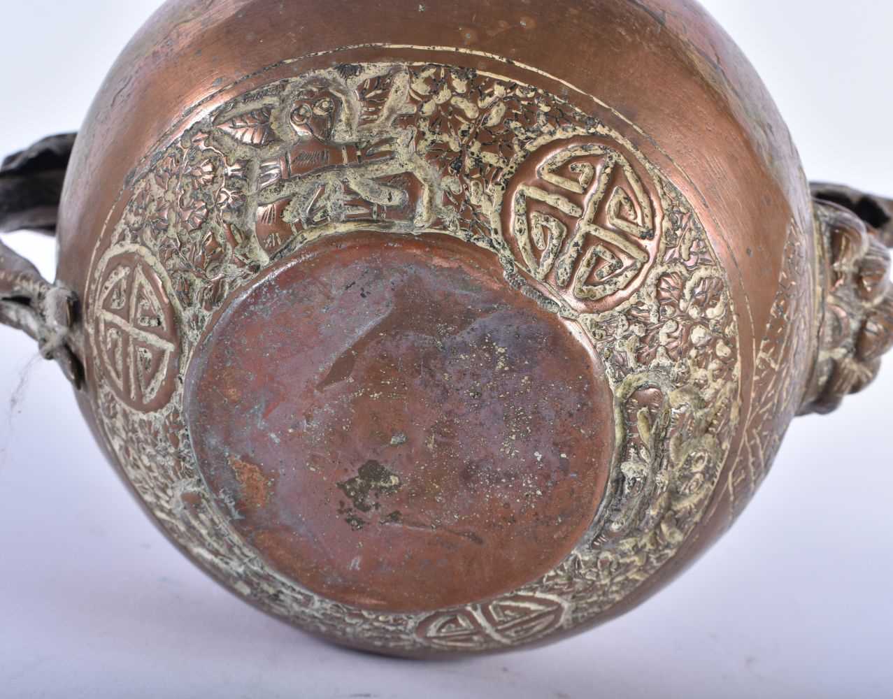 A 19TH CENTURY TIBETAN COPPER TEAPOT AND COVER decorated with repousse figures and foliage. 23 cm - Image 5 of 5