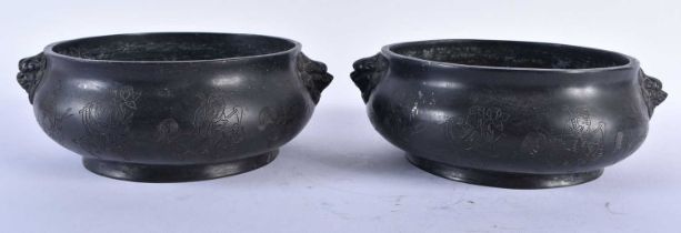 A PAIR OF CHINESE QING DYNASTY BRONZE CENSERS bearing Xuande marks to base, engraved with figures in