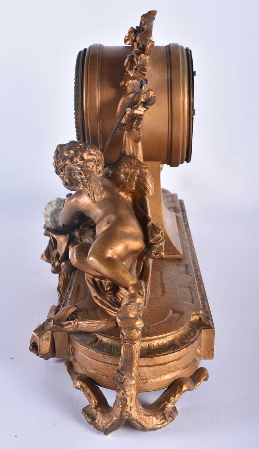 A LARGE 19TH CENTURY FRENCH BRONZE MANTEL CLOCK formed with a central drum encased by two putti. - Image 4 of 7