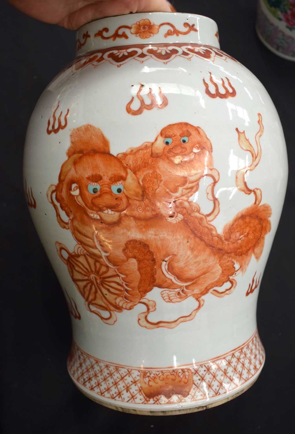 A LARGE PAIR OF CHINESE QING DYNASTY IRON RED PAINTED GINGER JARS AND COVERS painted with buddhistic - Image 6 of 26