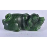 A CHINESE CARVED GREEN JADE TYPE ANIMAL 20th Century. 91.8 grams. 7 cm x 3 cm.