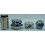 A Chinese porcelain blue and white bowl on a stand decorated with foliage together with a ginger jar