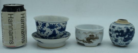 A Chinese porcelain blue and white bowl on a stand decorated with foliage together with a ginger jar