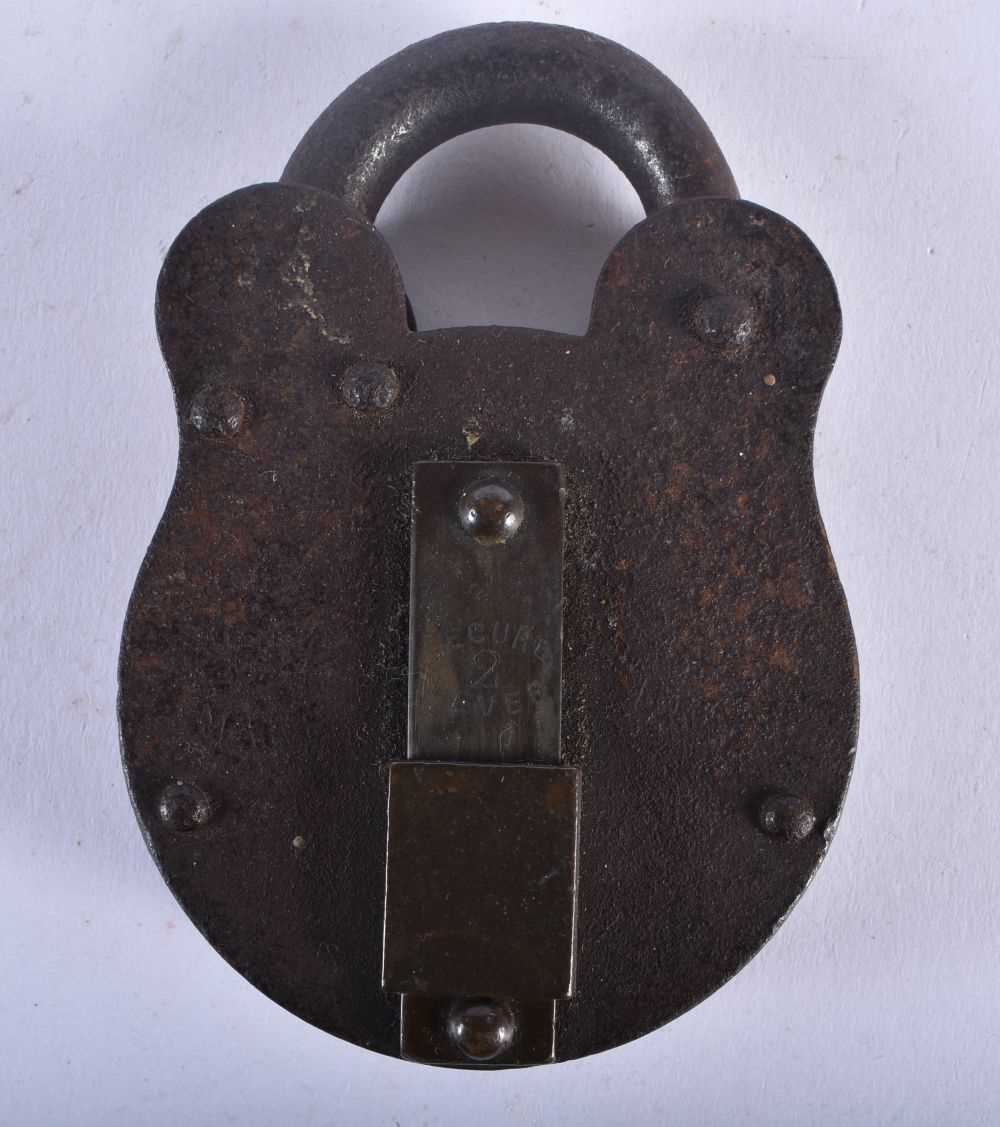 A PAIR OF ANTIQUE HANDCUFFS together with a similar padlock. Largest 24 cm long. (3) - Image 2 of 7