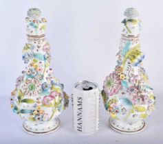 A PAIR OF EARLY 19TH CENTURY ENGLISH PORCELAIN ENCRUSTED VASES AND COVERS with gilt highlights. 29