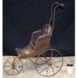 A small Victorian Childs leather upholstered Dolls pram 72 cm.