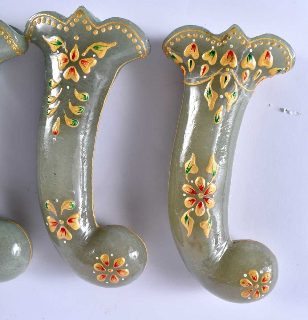 A SET OF FIVE MIDDLE EASTERN QAJAR LACQUER HARDSTONE DAGGER HANDLES overlaid with foliage and vines. - Image 2 of 6