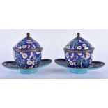 A PAIR OF 19TH CENTURY CHINESE CANTON ENAMEL TEABOWLS ON STANDS Qing. 14cm x 10 cm.