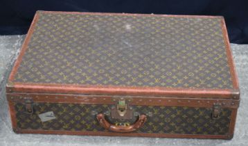 A Louis Vuitton suitcase 22 x 81 x 52 cm.