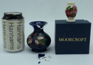 Boxed Moorcroft Seasonal Flower Collection Poinsettia Miniature Vase 2020 together with a Slipper