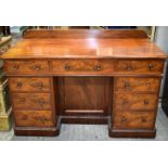 A Victorian flame mahogany 9 draw pedestal desk 90 x 136 x 61 cm.