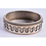 A Silver Cuff Bangle with Paste Stones inset on an arched decoration. 5.5 cm x 4.8 cm internal