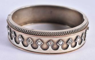 A Silver Cuff Bangle with Paste Stones inset on an arched decoration. 5.5 cm x 4.8 cm internal