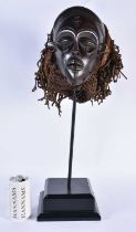 A LARGE EARLY 20TH CENTURY AFRICAN TRIBAL WOOD MASK with later stand. 58 cm x 14 cm.