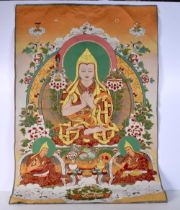 A Tibetan silk Tanka 90 x 61 cm