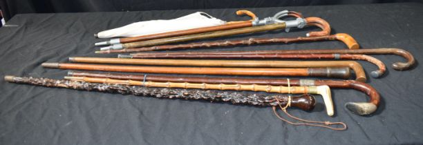 A collection of Vintage Shooting stick seats, canes and a Parasol 99 cm (11)