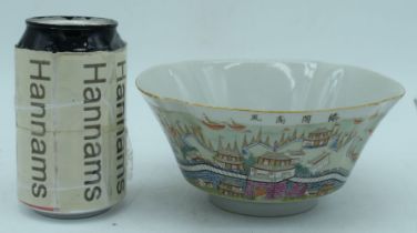 A Chinese porcelain Famille Rose bowl decorated with calligraphy and a walled city 8 x 17 cm.