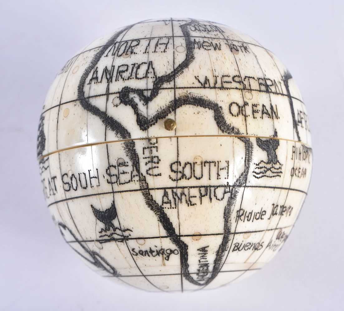 A CONTINENTAL BONE GLOBE COMPASS. 7 cm diameter.