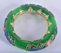 A Chinese Jade Bangle with Enamel Decoration. Internal diameter 5.6 cm, weight 107.8g