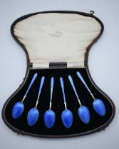 A SET OF SIX ART DECO SILVER AND ENAMEL COFFEE SPOONS. 81 grams. 10.5 cm long. (6)