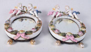 A pair of small Meissen porcelain mirrors 18.5 x 12 cm