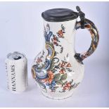 AN 18TH CENTURY EUROPEAN TIN GLAZED FAIENCE JUG with pewter mounts, painted with birds and