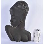 A VINTAGE CAST IRON BUST OF AN AFRICAN FEMALE in the manner of Hagenauer. 36 cm x 20 cm.