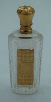 A 14CT GOLD AND GLASS SCENT BOTTLE. 49 grams. 8.75 cm x 2.75 cm.