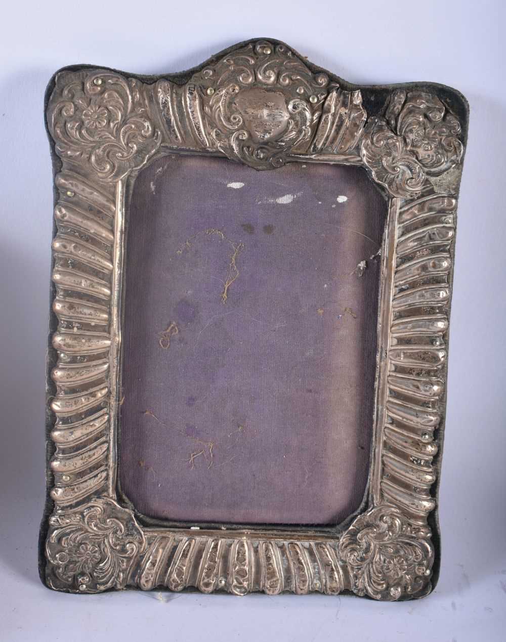 AN ANTIQUE SILVER PHOTOGRAPH FRAME together with another repousse frame & a pair of Russian cup - Image 3 of 5