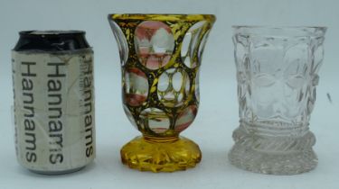 A German Von Teplitz engraved Citrine glass with examples of German buildings together with