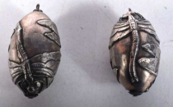 Two White Metal Egg Pendants. 4.5 cm x 2.6 cm, total weight 30.9g (2)