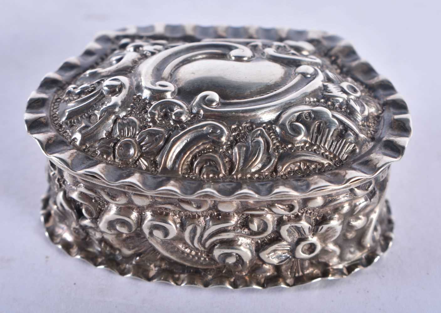 A Victorian Silver Shell Shaped Embossed Silver Pill Box. Hallmarked Birmingham 1897. 4.4cm x 3.3 cm