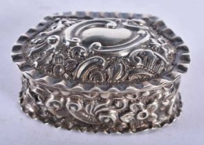 A Victorian Silver Shell Shaped Embossed Silver Pill Box. Hallmarked Birmingham 1897. 4.4cm x 3.3 cm