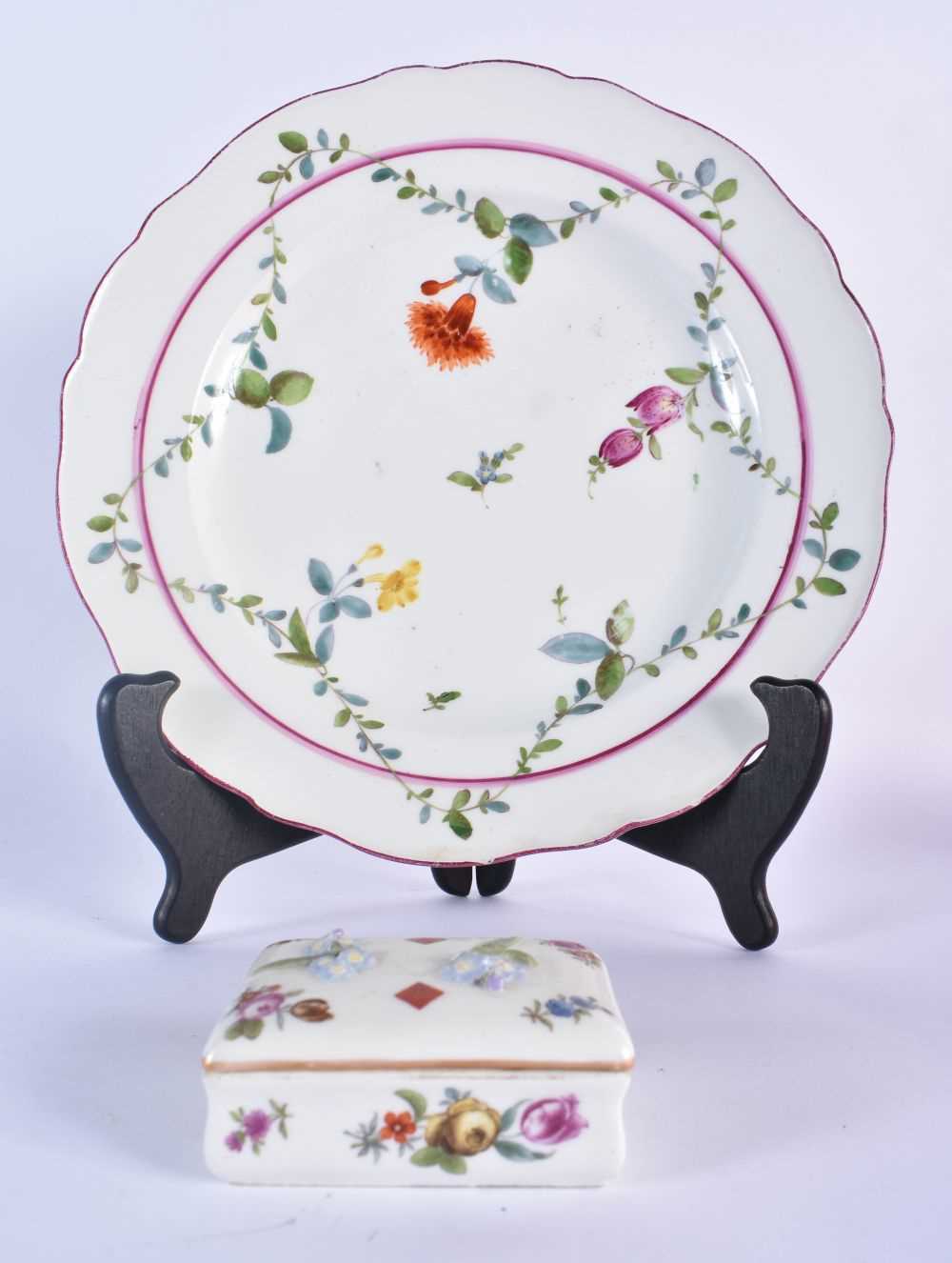 18th century Meissen plate painted with swags of leaves and flowers under a puce line circle and