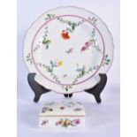 18th century Meissen plate painted with swags of leaves and flowers under a puce line circle and