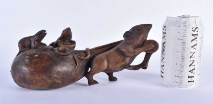 AN EARLY 20TH CENTURY JAPANESE MEIJI PERIOD CARVED WOOD OKIMONO modelled as a rat pulling a sack. 24