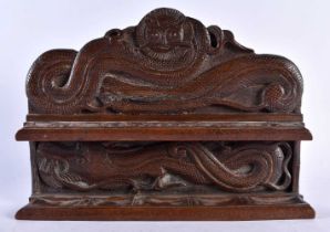 AN EARLY 20TH CENTURY ANGLO INDIAN KASHMIRI CARVED HARDWOOD PIPE STAND CECORATED WITH DRAGONS 22
