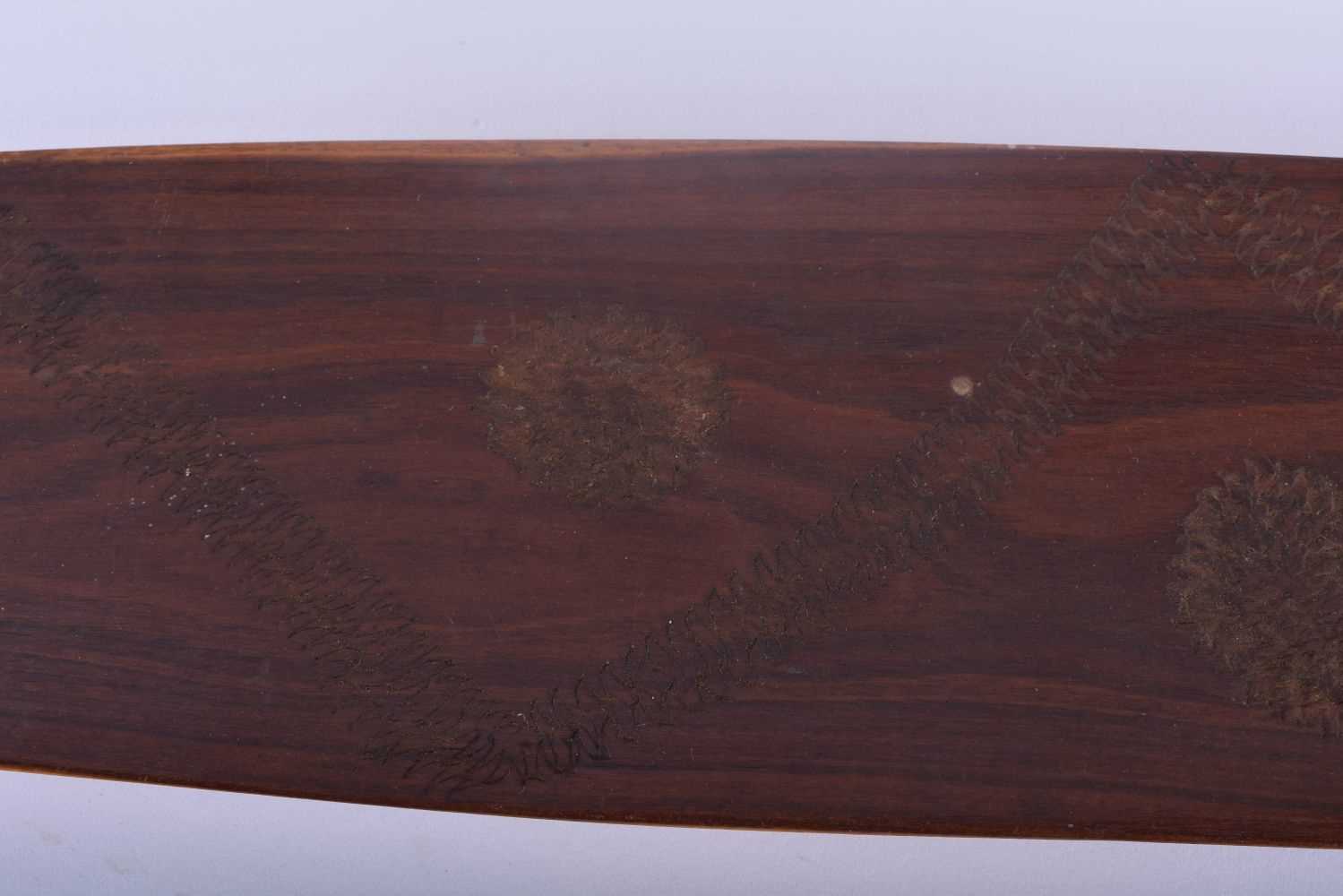 TWO ABORIGINAL TRIBAL CARVED WOOD SHORT PADDLES engraved with motifs. 70 cm long. (2) - Image 3 of 5