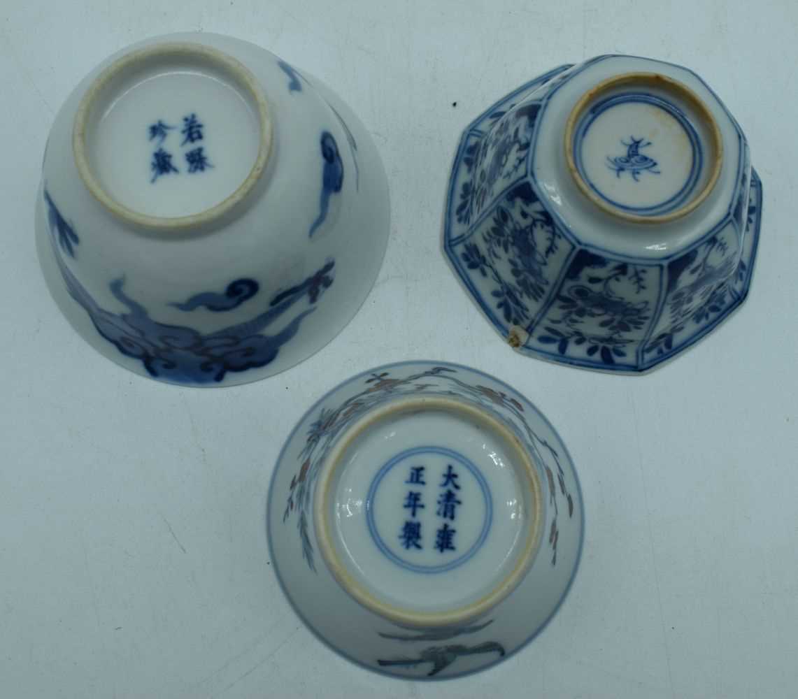 A small Chinese porcelain blue and white dragon bowl with two small bowls 6 x 9 cm. (3) - Image 4 of 6